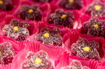 French or italian sweets, fruit jelly bonbons on display in confectionery shop in Milan, Italy close up