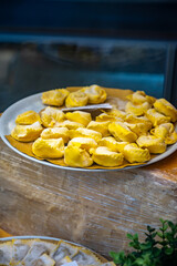 Italian food, fresh homemade stuffed pasta tortelli or ravioli dumplings ready to cook, Milan, Lombardy, Italy