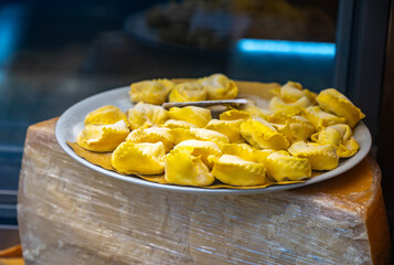 Italian food, fresh homemade stuffed pasta tortelli or ravioli dumplings ready to cook, Milan, Lombardy, Italy
