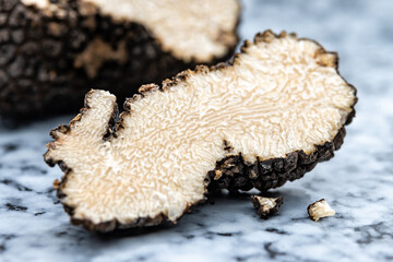 Italian black summer truffle, tasty aromatic mushroom, close up