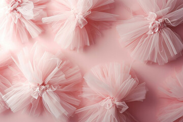 Pink tulle tutus on a pink background for a whimsical and playful flat lay composition with copy space