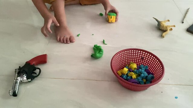 Children playing with plasticine