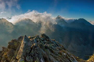 Rocky mountains with blue sky and beautiful clouds. Sunset over High Tatras mountains national...