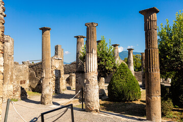 Ruins of ancient italian town Pompei, Italy. Ancient columns. Summer time.