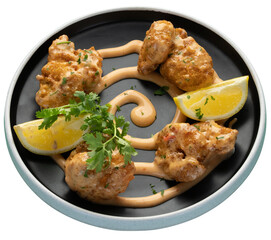 Shrimps fry tossed in a spicy sauce served with lemon wedge and coriander leaf