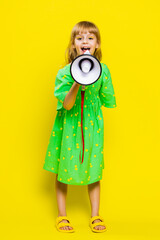 Young blonde child girl kid talking with megaphone, proclaiming news, loudly announcing...