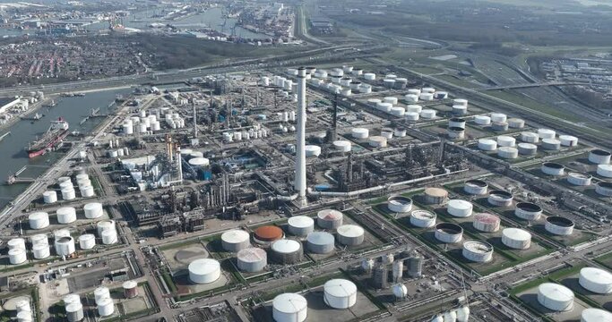 Aerial drone view one of the largest refineries in The Netherlands in the port of Rotterdam, Pernis. Petroleum industry fossil fuels manufacturing and processing.
