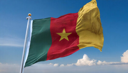 Naklejka na ściany i meble Die Fahne von Kamerun, flattert im Wind, isoliert, gegen den blauen Himmel