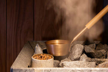 ladle for pouring water on hot stones in the sauna and steam 