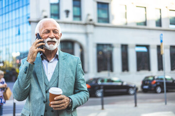 Shot of a mature businessman using his smartphone to make a phone call