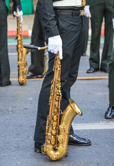 Marching Band Performers are waiting for Playing Alto saxophone