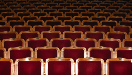 Row of red seats in theatre