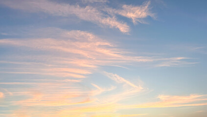 Sunset or sunrise sky background. Soft clouds in twilight sky time.