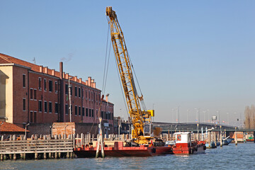 Barge Vessel With Construction Crane at Water Canal in Venice City Italy