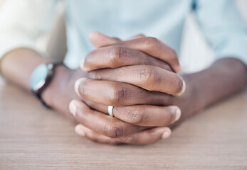Closeup, hands clasped and desk for business, meeting or job interview negotiation in startup. Table, worker and fingers of professional in conversation, discussion or advisor thinking of decision