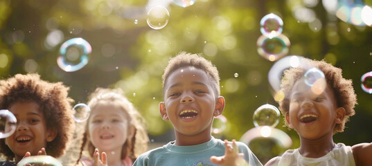 A diverse group of young friends with bright, toothy smiles, enjoying a sunny day as they participate in a soap bubble show