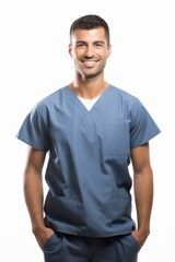 Obraz premium b'Portrait of a smiling young male doctor in blue scrubs'