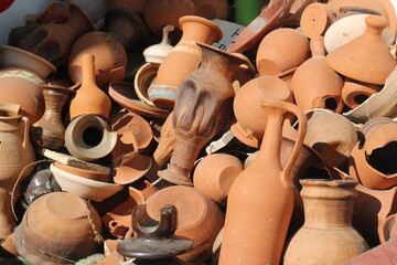 stacked together broken clay pots