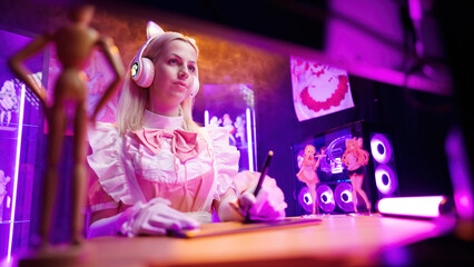 Maid cosplay anime artist drawing on tablet view from under the monitor