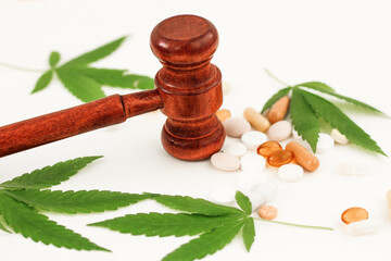 Marijuana, pills and judge's hammer, concept of rights and law, drug addiction