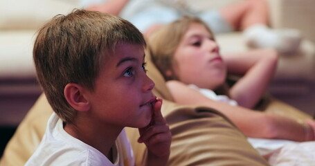 children watching tv movie in the evening