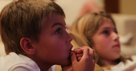 Children watching TV screen at home kids hypnotized by content