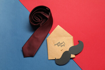Card with phrase Happy Father's Day, paper mustache and necktie on color background, flat lay