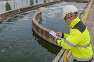 Environmental engineers work at wastewater treatment plants,Water supply engineering working at Water recycling plant for reuse