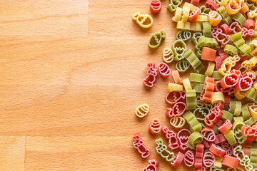Colorful Easter pasta on a wooden cutting board