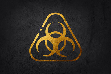 Biohazard 3d golden metal symbol on abstract black background.