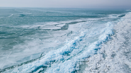 spring ice drift on the lake. ice hummocks