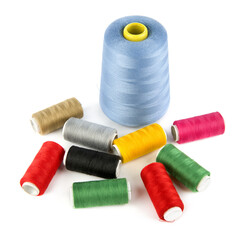Set of spools of multi-colored threads isolated on a white.