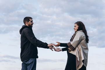 Man and Woman Holding Hands