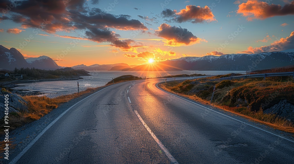 Aufkleber a road with a sunset in the background. the road is wet and the sun is setting. the sky is cloudy an