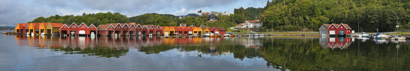 Colorful houses at the bay Svennevikbukta at Svennevik in Norway, Europe
