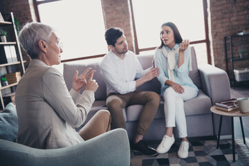 Photo of young couple appointment psychotherapist lady talk loft interior office indoors