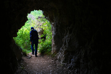 Stone carved tunnel in Nerei Gorges Natural Park, Romania, Europe