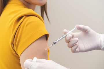 Health care, corona virus, hand of woman nurse, doctor giving syringe vaccine, injection dose on arm sick patient at clinic. Vaccination, immunization disease prevention against flu pandemic influenza