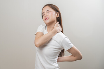 Pain body muscles stiff problem, asian young woman, girl painful with back, neck ache from work hand holding massaging rubbing shoulder hurt, sore on white background. Health care and medicine concept