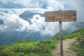 Wooden sign post isolated on village path with white clouds and mountain Direction concept. Mock up, template