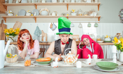 Funny crazy group of friends fool around with mad tea party concept