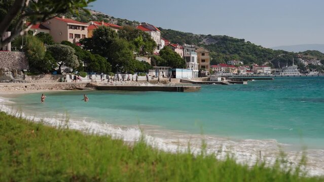 Beach in Baska on the island of Krk in Croatia. Adriatic Sea and tourist resort