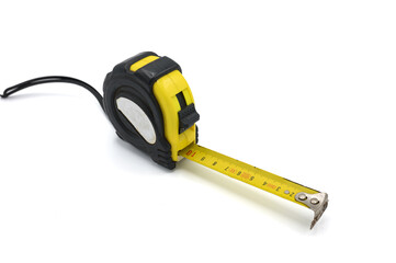 Detail of a roll-up and portable steel sheet measuring tape on a white background. Basic tool for...