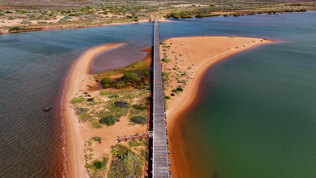 Aerial of the long pedestrian bridge at the ocean, Carnarvon, Western Australia, Australia, Pacific