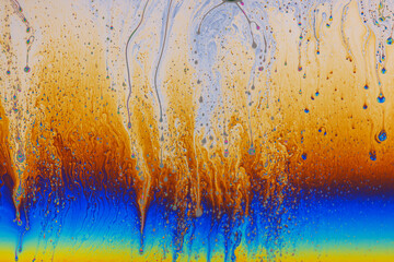 Colorful liquid mixture, blending paints in dynamic abstract fluid texture background, close up...