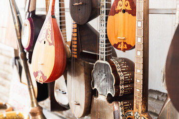 A variety of Central Asian stringed musical instruments are put up for sale