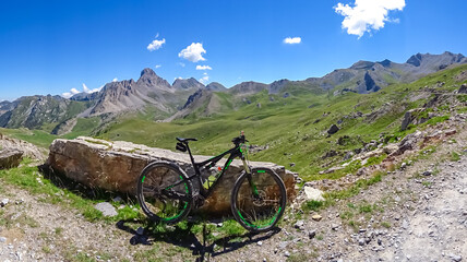 Mountain bike on scenic trail with view of Rocca La Meja near rifugio della Gardetta on Italy...