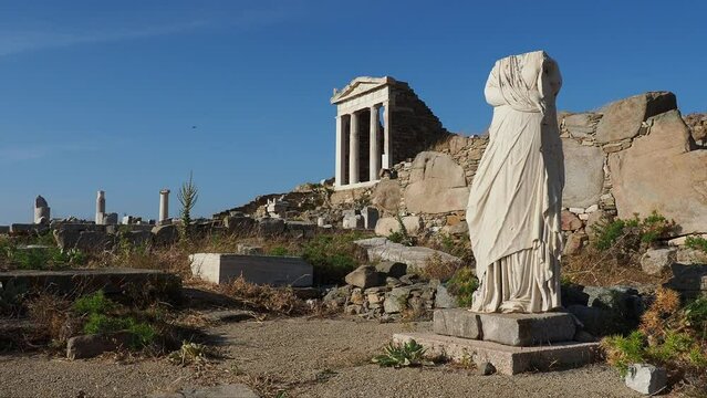 Headless Statue and the Temple of Isis, Delos Archaeological Site, UNESCO World Heritage Site, Delos Island, Cyclades, Greek Islands, Greece, Europe