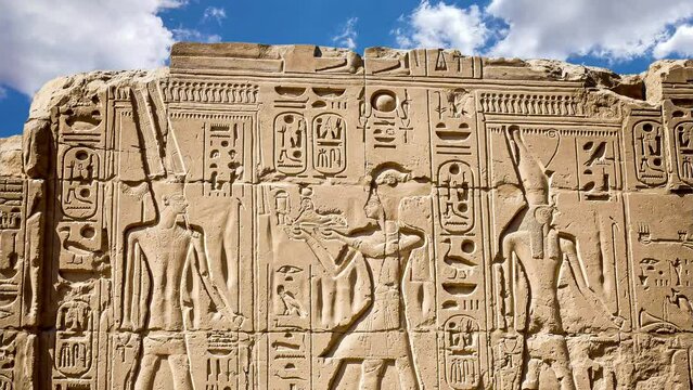 Ancient Egyptian carvings and hieroglyphs at the Temple of Karnak in Luxor, Egypt