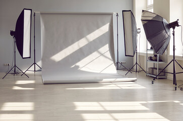 Interior of an empty modern photo studio with professional lighting equipment of rectangular...